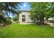 Expansive backyard featuring a well-maintained lawn and mature trees at 505 Orchard Dr, Louisville, CO 80027
