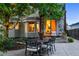 Inviting backyard with patio area for outdoor dining and a glimpse of the home's interior at 505 Orchard Dr, Louisville, CO 80027