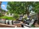 Relaxing backyard patio with a fire pit and ample seating for entertaining at 505 Orchard Dr, Louisville, CO 80027