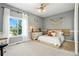 Serene bedroom with a bohemian flair, light gray walls, decorative accents, and a large window for natural light at 505 Orchard Dr, Louisville, CO 80027