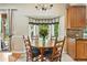 Inviting dining nook is complemented by a bay window, cabinetry, and natural light at 505 Orchard Dr, Louisville, CO 80027
