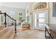 Welcoming entryway features tile flooring, a staircase, and an abundance of natural light at 505 Orchard Dr, Louisville, CO 80027