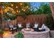 Charming fire pit area with Adirondack chairs, perfect for cozy outdoor gatherings under string lights at 505 Orchard Dr, Louisville, CO 80027