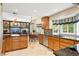 Spacious kitchen features a breakfast bar, tile flooring, and stainless steel appliances at 505 Orchard Dr, Louisville, CO 80027