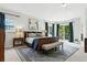 Spacious main bedroom with a king bed, ensuite bathroom access, and access to a private balcony at 505 Orchard Dr, Louisville, CO 80027
