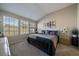 Comfortable bedroom with vaulted ceiling, ample natural light, and neutral decor at 7679 S Biloxi Way, Aurora, CO 80016