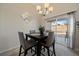 Cozy dining room with natural light and a sliding glass door leading to the patio at 7679 S Biloxi Way, Aurora, CO 80016