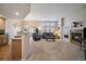 Bright living area featuring plush furniture, a cozy fireplace, and abundant natural light at 7679 S Biloxi Way, Aurora, CO 80016