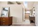 Open Primary bathroom showcasing a double sink vanity, tiled shower, and a bright skylight, creating a spa-like atmosphere at 9271 Wheeler Ct, Highlands Ranch, CO 80126