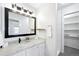 Modern bathroom vanity with large mirror and stylish lighting at 1383 W 88Th Ave # 307, Thornton, CO 80260