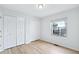 Bright bedroom featuring hardwood floors and a closet at 1383 W 88Th Ave # 307, Thornton, CO 80260