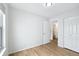 Bedroom with light colored floors, a closet, and access to a bathroom at 1383 W 88Th Ave # 307, Thornton, CO 80260