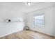 Bright bedroom with hardwood floors, white walls, and a sunny window at 1383 W 88Th Ave # 307, Thornton, CO 80260