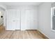 Bright bedroom featuring hardwood floors and a closet at 1383 W 88Th Ave # 307, Thornton, CO 80260