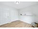 Clean bedroom featuring wood floors, a shelf, and closet at 1383 W 88Th Ave # 307, Thornton, CO 80260