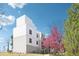 Well-maintained exterior with large trees, including a red blossoming tree, offering shade and visual appeal at 1383 W 88Th Ave # 307, Thornton, CO 80260