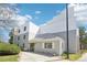 Gray and white building with well-maintained landscaping, including green grass, a small flowering tree, and shrubbery at 1383 W 88Th Ave # 307, Thornton, CO 80260