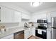 Bright kitchen with modern stainless steel appliances and ample counter space at 1383 W 88Th Ave # 307, Thornton, CO 80260
