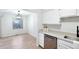 Cozy kitchen view adjacent to bright living space, and hardwood flooring at 1383 W 88Th Ave # 307, Thornton, CO 80260