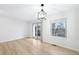 Sunlit living room featuring hardwood floors and large windows with natural light at 1383 W 88Th Ave # 307, Thornton, CO 80260
