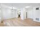 Open-concept living room offering hardwood floors and a view into the kitchen at 1383 W 88Th Ave # 307, Thornton, CO 80260