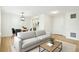 Comfortable living room with hardwood floors next to dining area and kitchen at 1383 W 88Th Ave # 307, Thornton, CO 80260