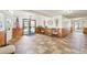 Welcoming lobby with tiled floors, American flag, clock and bench and plants providing a comfortable entrance at 1383 W 88Th Ave # 307, Thornton, CO 80260