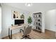 Modern office space with desk, bookshelf, and natural light at 1383 W 88Th Ave # 307, Thornton, CO 80260