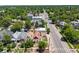An aerial shot of a residential neighborhood with tree-covered streets and diverse architectural home designs at 3106 N Franklin St, Denver, CO 80205