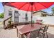 Outdoor dining area with a large umbrella, grill and patio, perfect for entertaining at 3106 N Franklin St, Denver, CO 80205