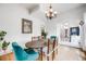 Bright dining room featuring hardwood floors, chandelier lighting, and plant at 3106 N Franklin St, Denver, CO 80205