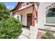 Inviting front porch with decorative columns and charming architectural details at 3106 N Franklin St, Denver, CO 80205