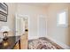 Hallway featuring hardwood floors, a colorful rug, and white trim at 3106 N Franklin St, Denver, CO 80205