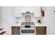 Modern kitchen with stainless steel appliances, stylish backsplash, and ample counter space at 3106 N Franklin St, Denver, CO 80205