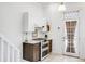 Cozy kitchen featuring updated appliances, white cabinets, and lots of natural light at 3106 N Franklin St, Denver, CO 80205