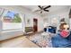 Bright living room featuring hardwood floors, bench seating, and large windows at 3106 N Franklin St, Denver, CO 80205