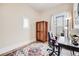 Bright home office with hardwood floors, a colorful rug, and large windows at 3106 N Franklin St, Denver, CO 80205