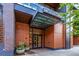 Inviting building entrance at 1901 Wazee Street with glass doors and wood accents at 1901 Wazee St # 305, Denver, CO 80202