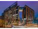 Striking exterior shot of the building at dusk showcasing the architectural details and connected towers at 1901 Wazee St # 305, Denver, CO 80202