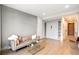 Relaxing living room with hardwood floors, a comfortable sofa, and convenient Murphy bed at 1901 Wazee St # 305, Denver, CO 80202