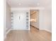 Inviting living room featuring a built-in murphy bed and view into the modern kitchen at 1901 Wazee St # 305, Denver, CO 80202