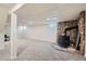 Large finished basement featuring plush carpet and a stone-clad fireplace at 366 Kenton St, Aurora, CO 80010