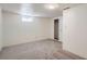 Carpeted bedroom with closet and natural light from a single window at 366 Kenton St, Aurora, CO 80010