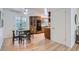 Bright kitchen featuring wood cabinets, and an adjacent dining area at 366 Kenton St, Aurora, CO 80010