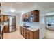 Spacious kitchen boasts stainless steel appliances and oak cabinetry at 366 Kenton St, Aurora, CO 80010