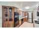 Updated kitchen features oak cabinets, stainless steel appliances, and ample counter space at 366 Kenton St, Aurora, CO 80010