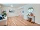 Bright living room features hardwood floors, neutral paint, and ample natural light at 366 Kenton St, Aurora, CO 80010