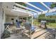 Covered patio with lounge chairs and grill, perfect for outdoor dining and relaxing at 366 Kenton St, Aurora, CO 80010