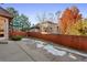 Private backyard with a patio and wooden fence at 486 S Youngfield Cir, Lakewood, CO 80228