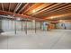 Unfinished basement with high ceilings and concrete floors at 486 S Youngfield Cir, Lakewood, CO 80228